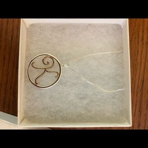 Silver and gold K necklace